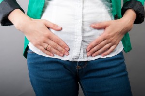 Businesswoman with abdominal pains